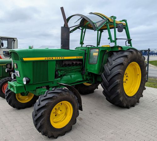 Free A classic John Deere tractor parked outdoors with clear copy space in Werlte, Germany. Stock Photo