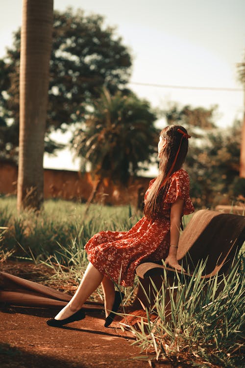 Woman in Red Dress on Bench