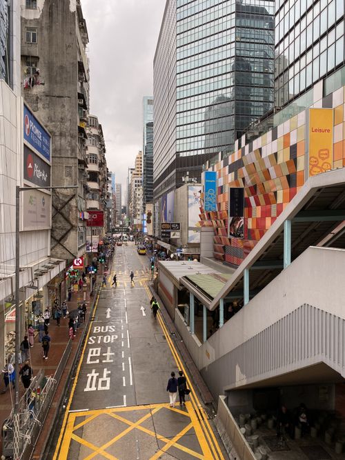 Free Dynamic street scene showcasing urban life and modern architecture in Hong Kong. Stock Photo