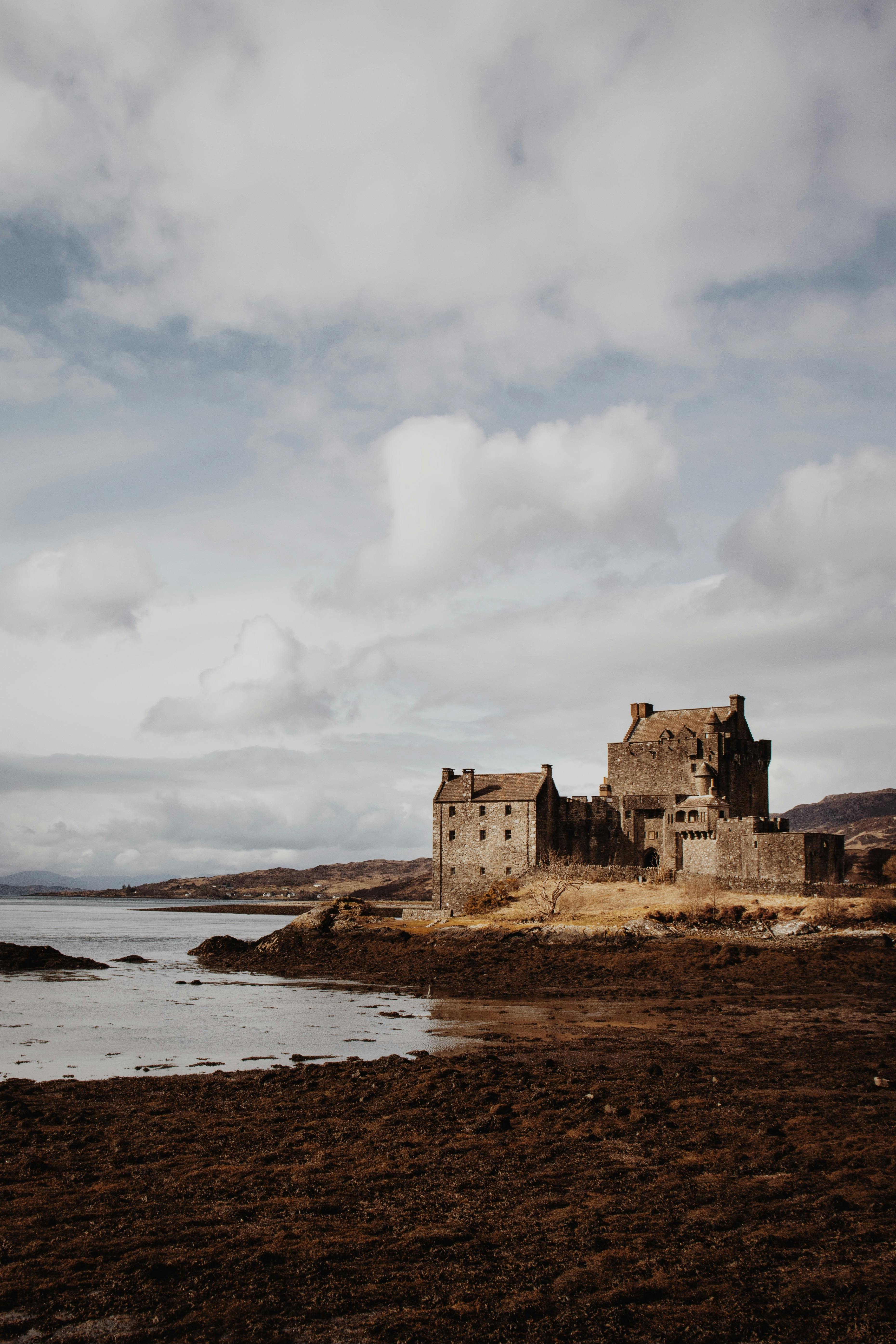 clouds floating over the eilean donan castle in autumn