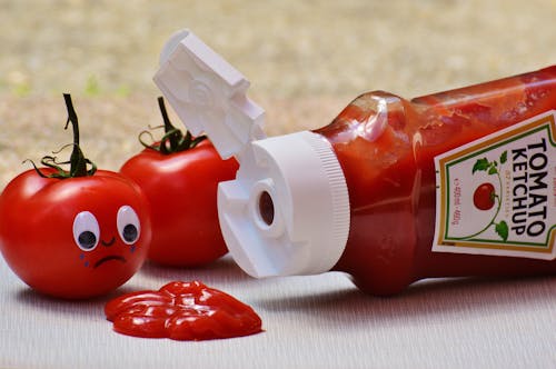2 Tomatoes Beside Tomato Ketchup Ketchup