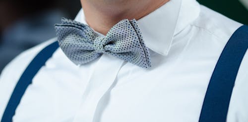 Free Man in White Dress Shirt Blue Suspenders and Gray Polka Dotted Bowtie Stock Photo