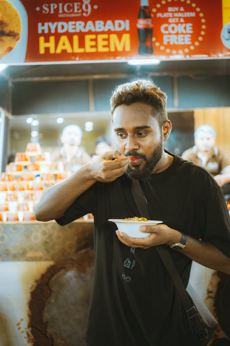 Man Eating From Bowl