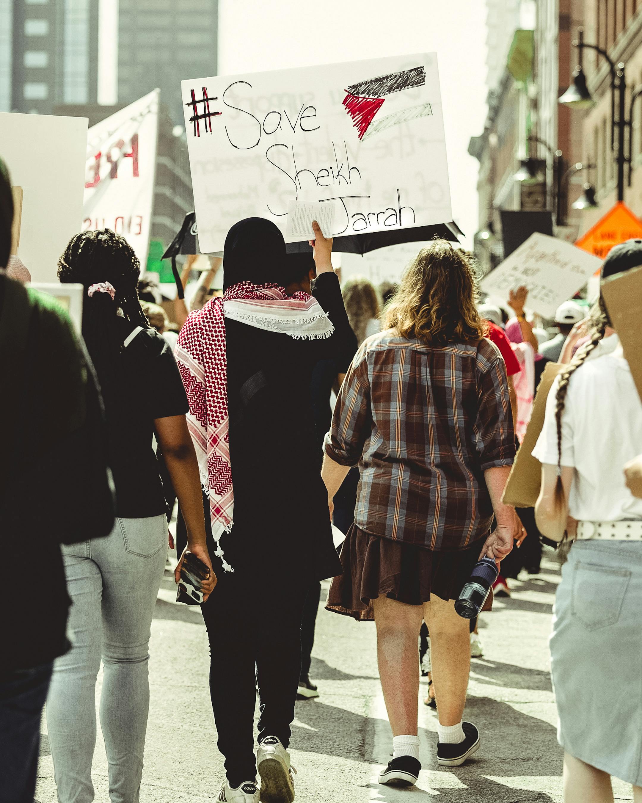 a woman holding a sign that says women s rights are human rights