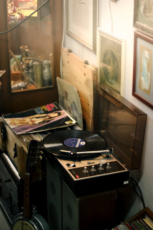 A Record Player and a Pile of Vinyl Records 