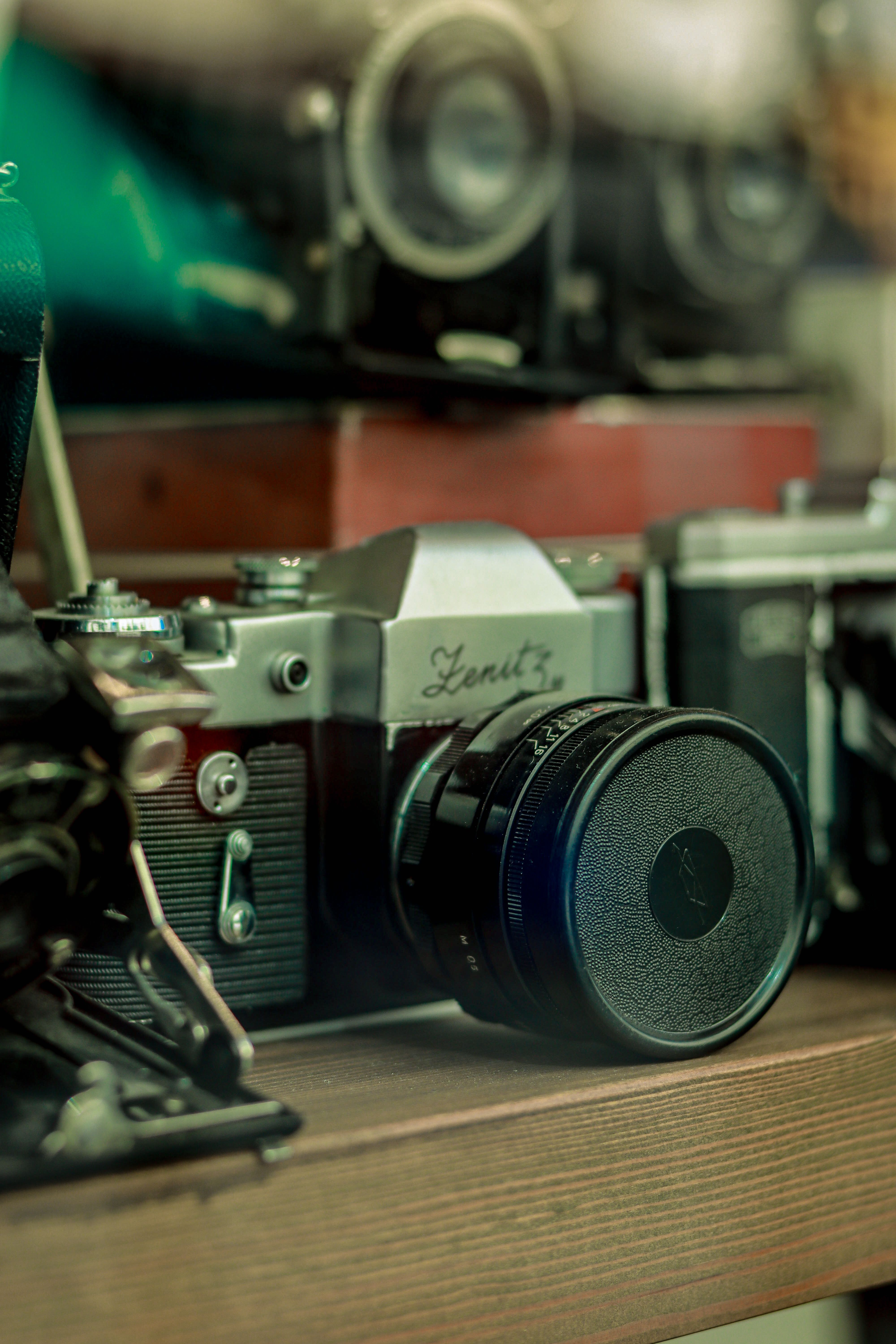 Classic Zenit analog camera displayed on a shelf, evoking nostalgia and retro charm.
