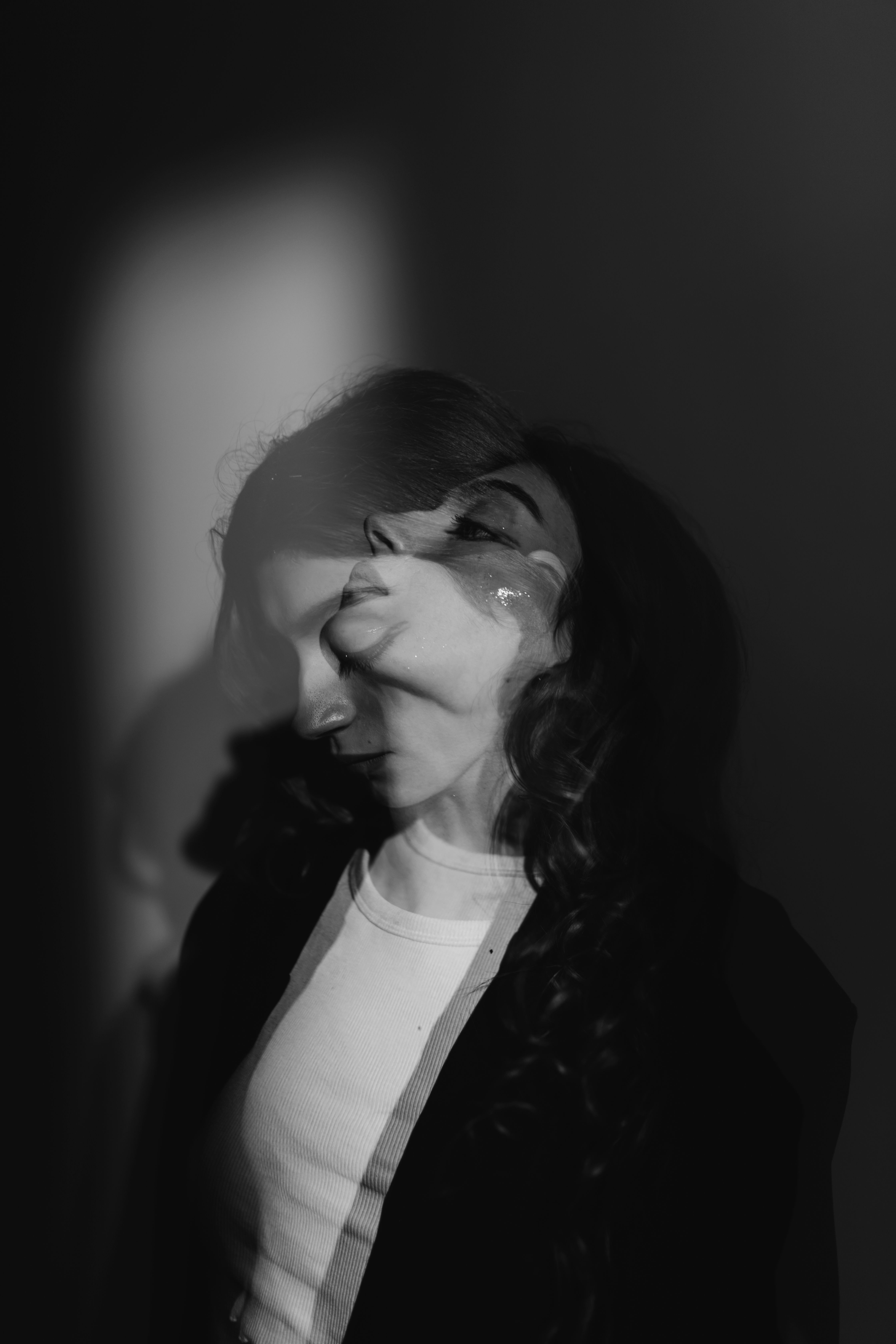 Portrait of a Woman in a Dark Room · Free Stock Photo