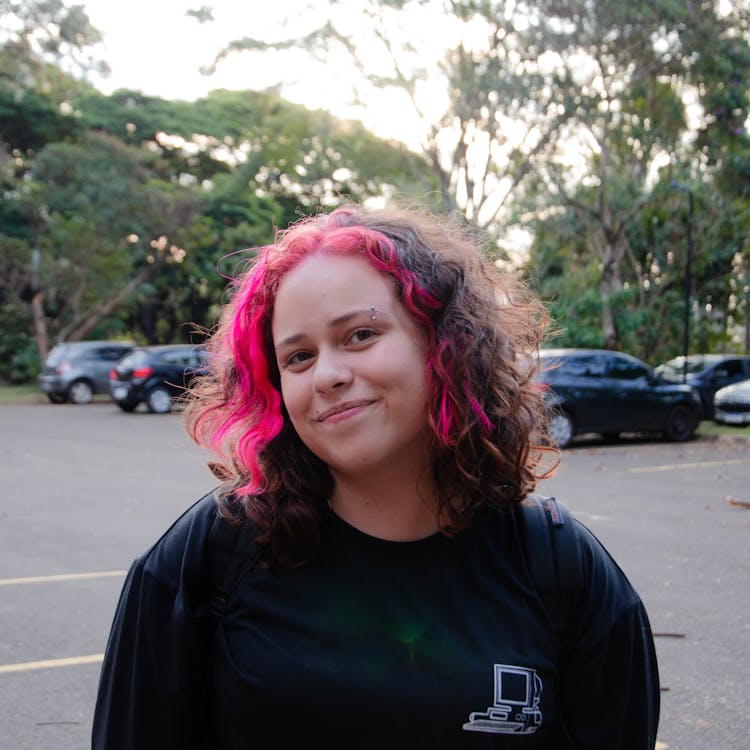 Smiling Girl With Red Hair Highlights