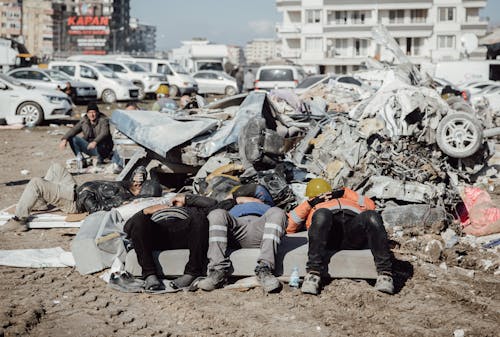 Rescuers Sleeping among Urban Ruins