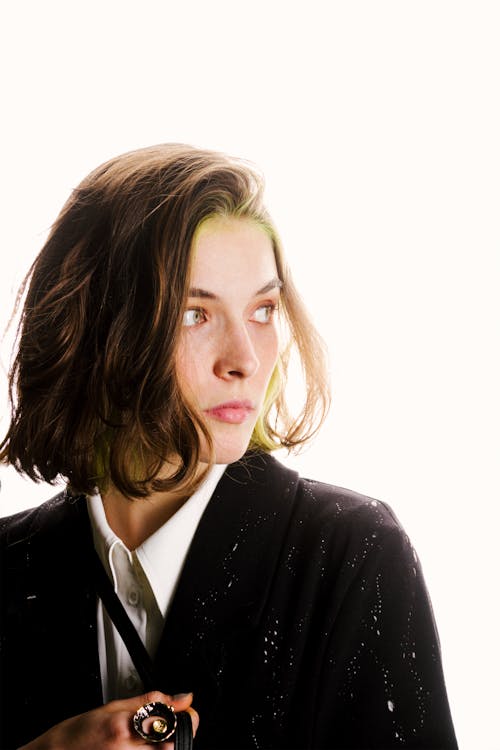 Portrait of a Young Woman in a Black Jacket and White Shirt 