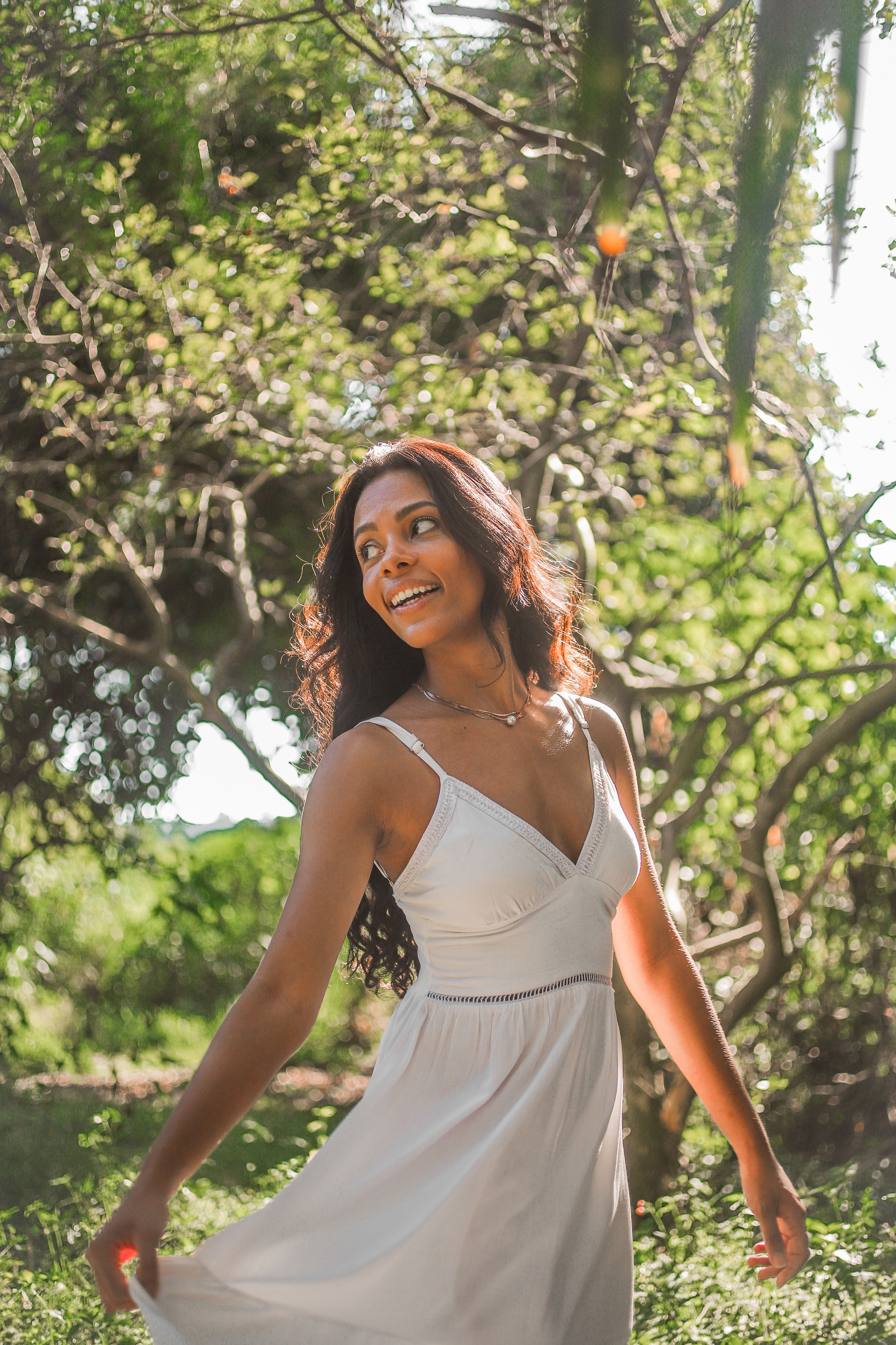 Portrait of a Woman in White Sleeveless Dress  Free Stock Photo
