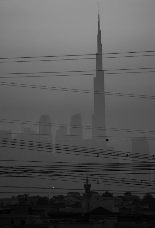 Overhead Lines and Fog Obscuring the Cityscape