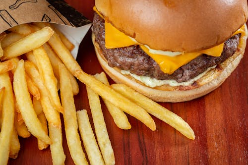 Fries Spilled by a Cheeseburger