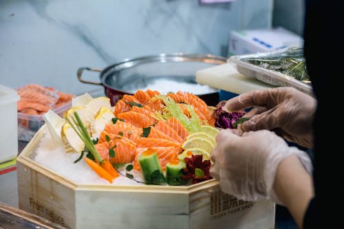 Chefs Hands Preparing Sashimi Set