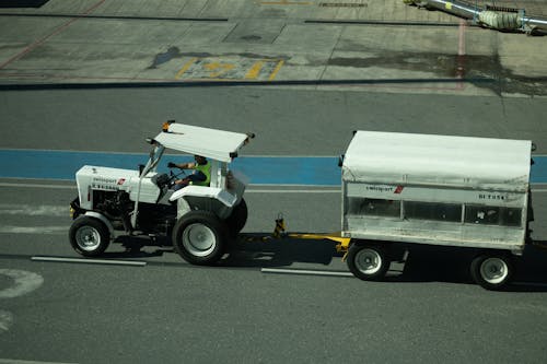 High Angle Shot of a Tractor Pulling a Trailer 