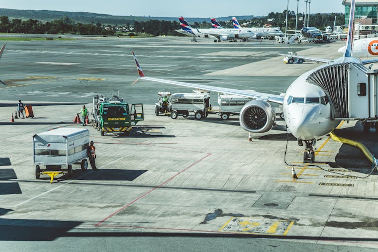 Ground Crew Working At The Airport Tarmac