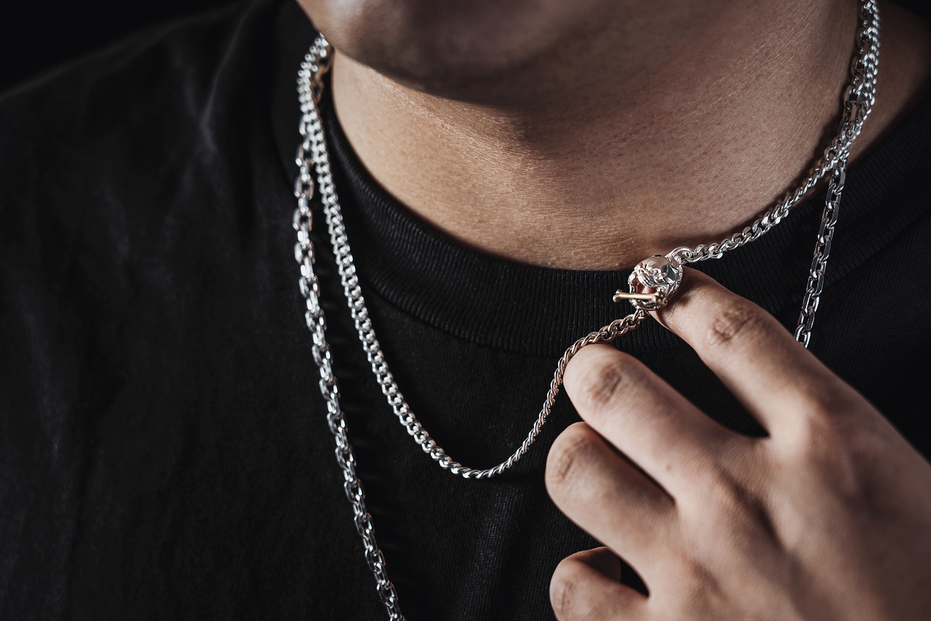 Layered silver chains worn at different lengths