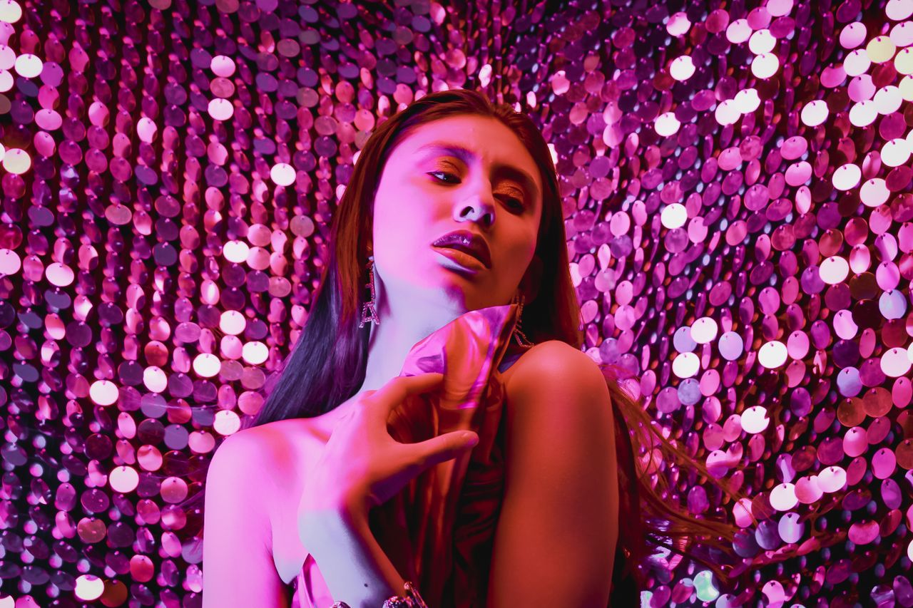 a striking portrait of a woman surrounded by shimmering lights in a vi