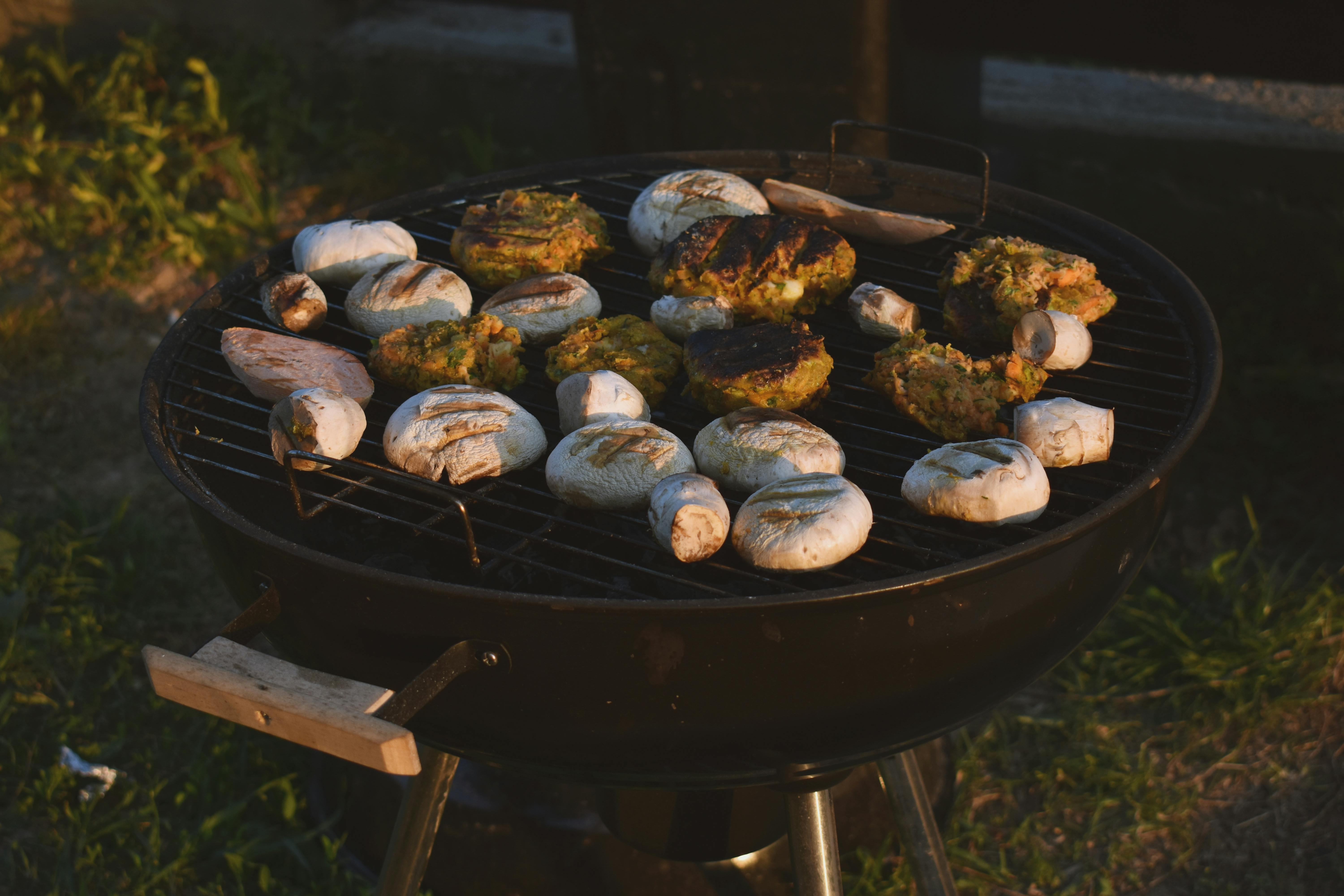 assorted grilled food on black grill