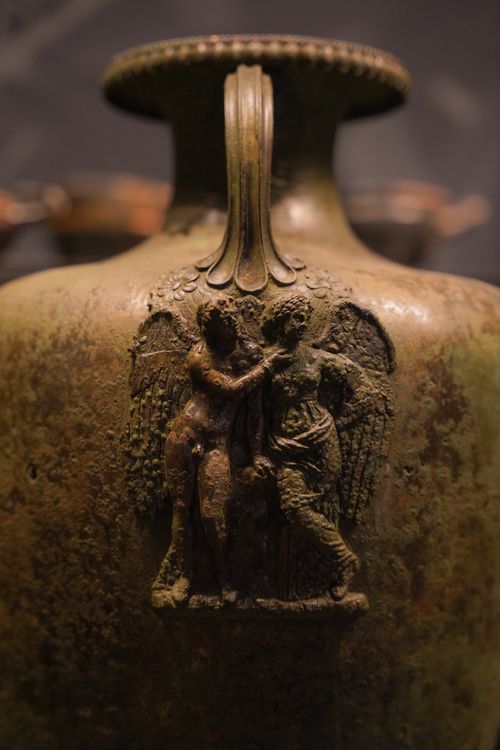 Free Close-up of a bronze vase with detailed angelic relief carving, Istanbul museum. Stock Photo
