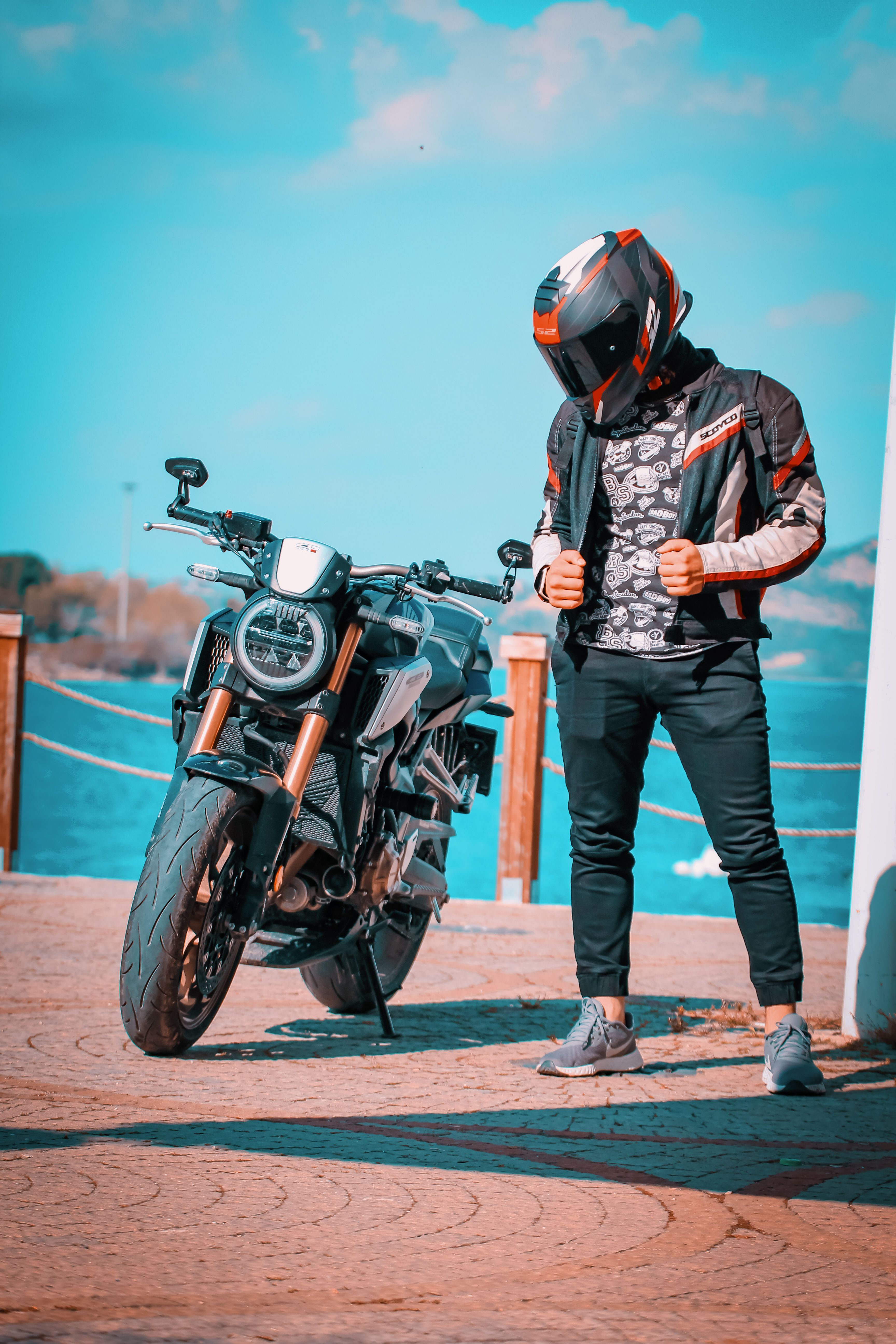 Person Standing and Posing on Riding Motorbike · Free Stock Photo