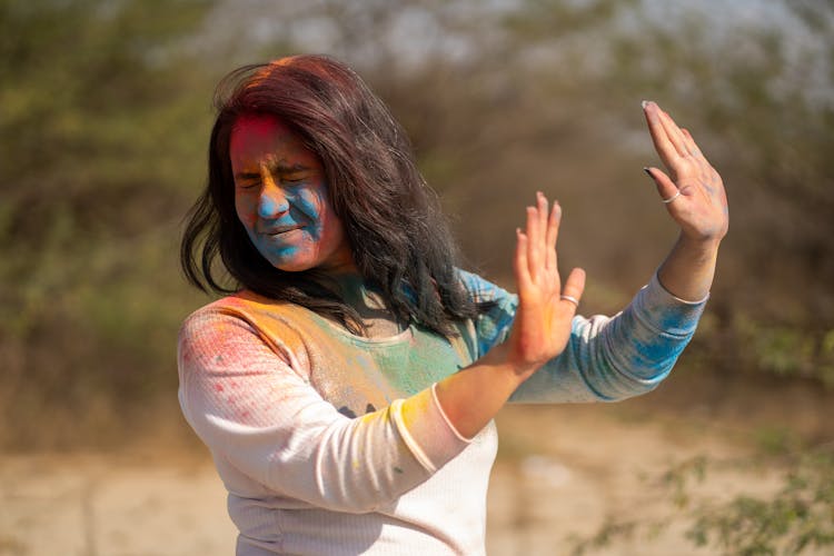 Woman In Paint Celebrating Holi