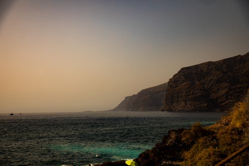 Free Explore the breathtaking sunset over the cliffs of Los Gigantes in Tenerife, Spain. Stock Photo