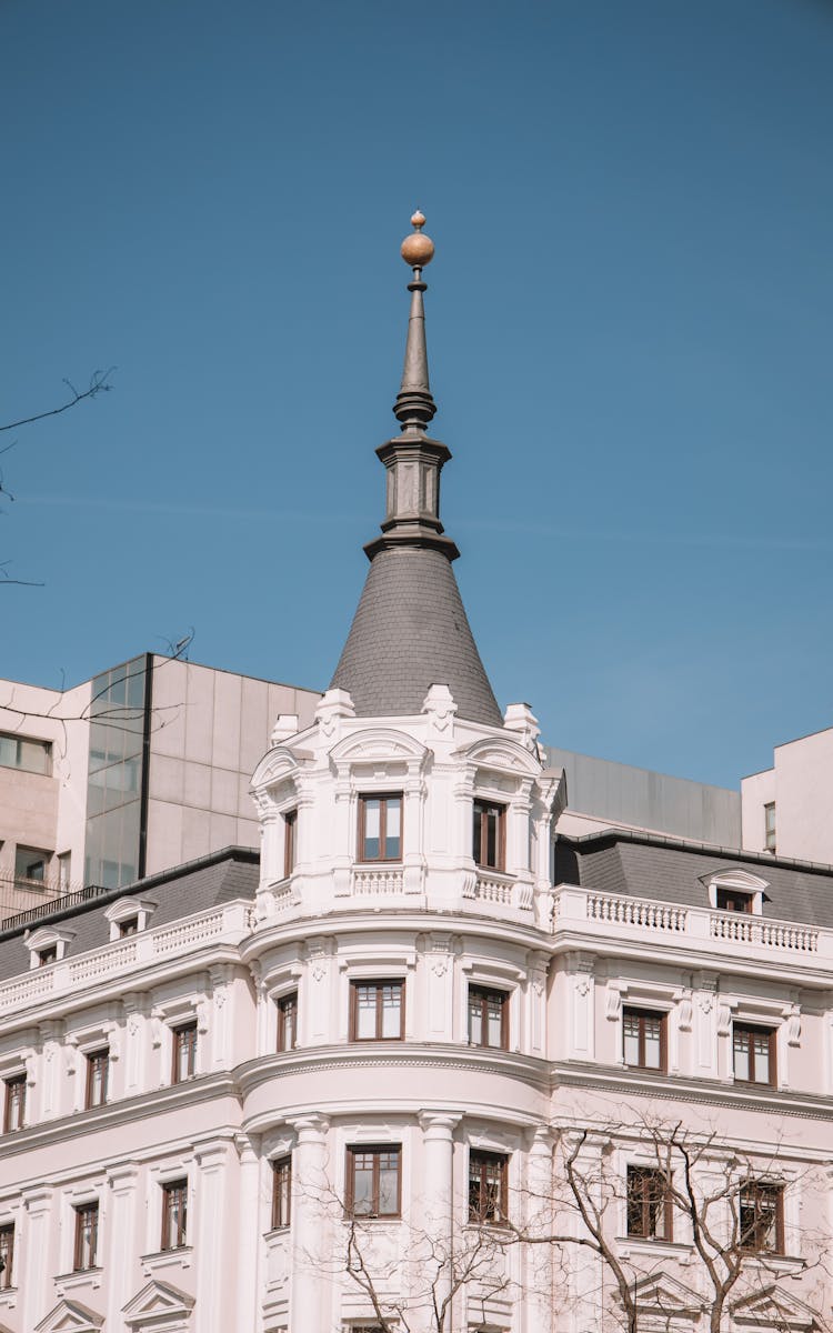 Historic Building With Tower On Blue Sky