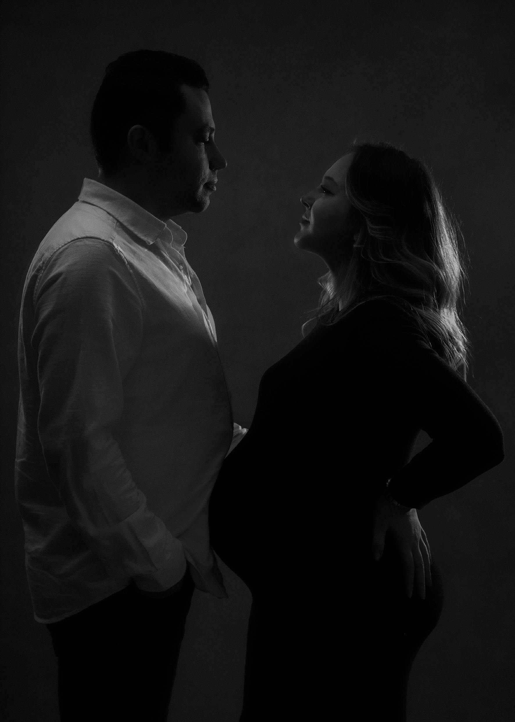 Black and White Shot of a Husband and a Pregnant Wife Standing Face to Face  · Free Stock Photo