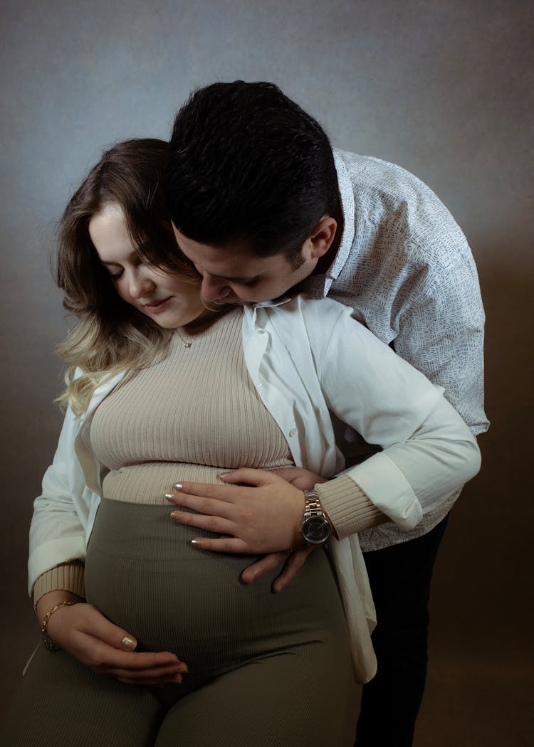 Husband Embracing His Pregnant Wife 