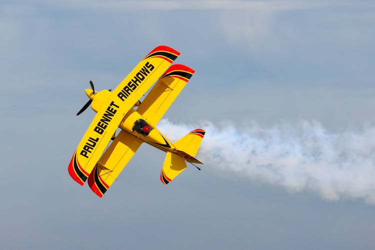 Biplane Flying In The Sky