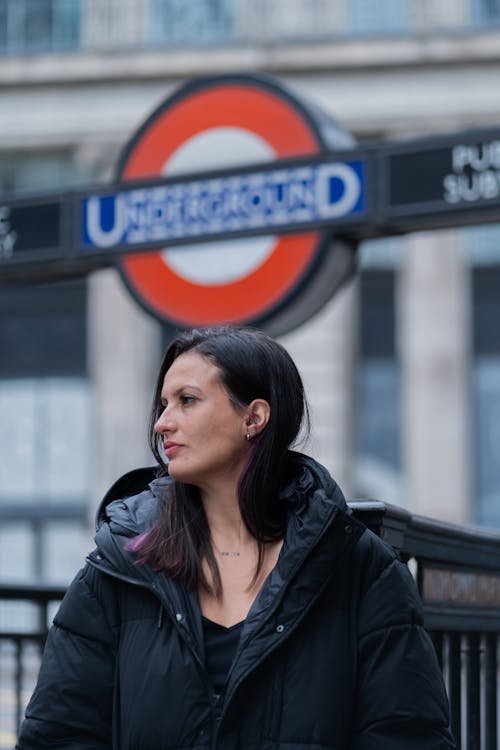 Woman in Jacket near Subway in UK