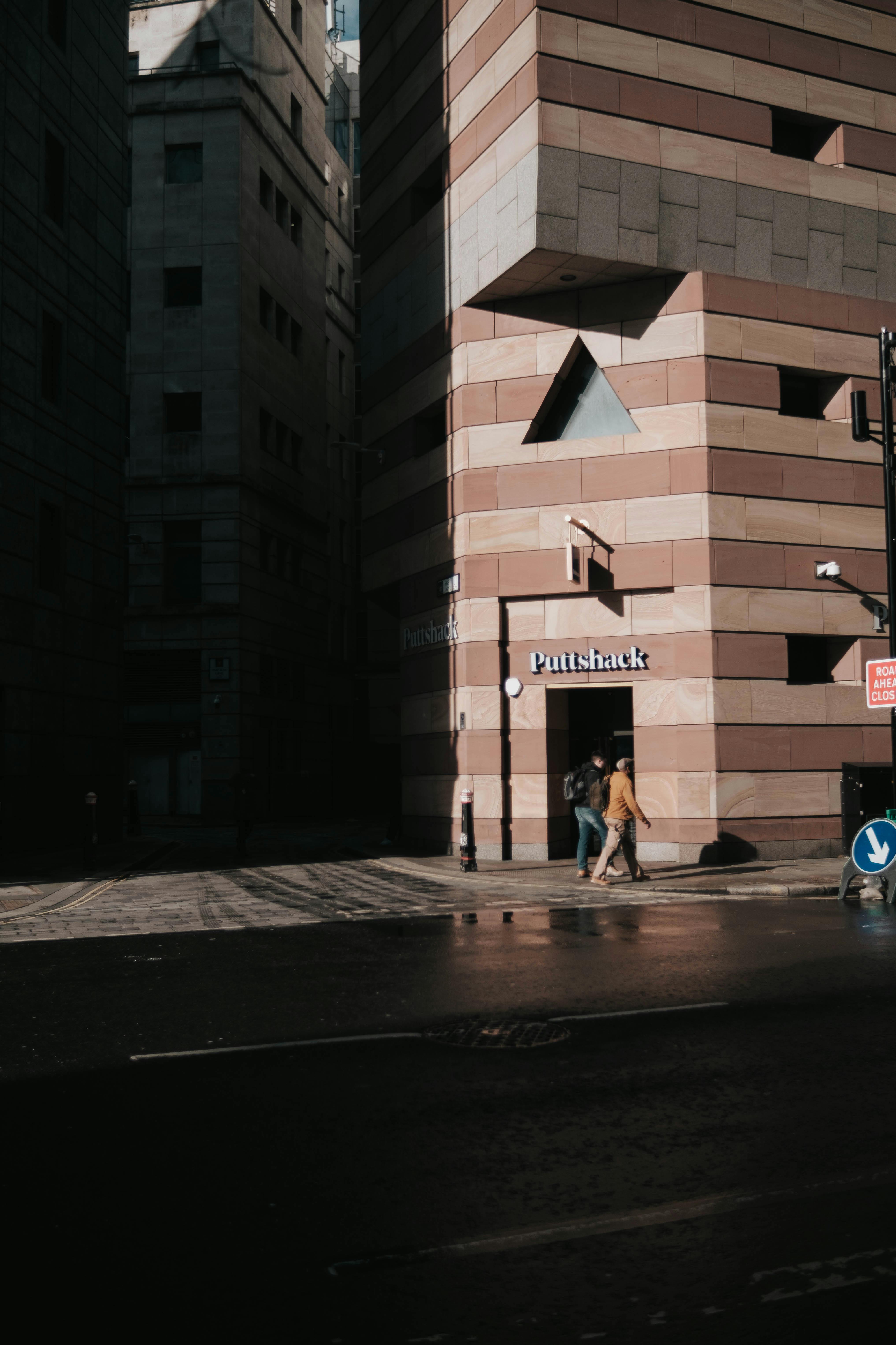 Free City street view with pedestrians and modern urban architecture at day time. Stock Photo