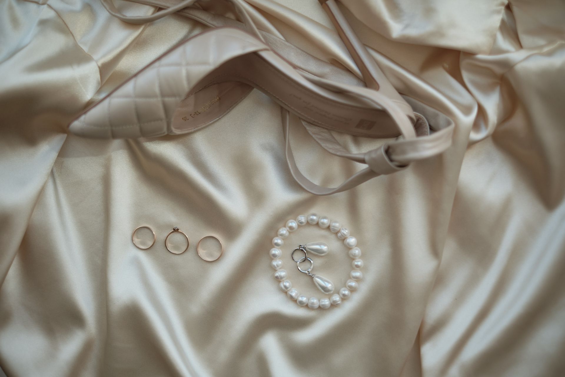 Jewelry next to a Shoe