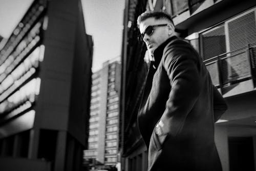 Man in Coat and Sunglasses in Black and White