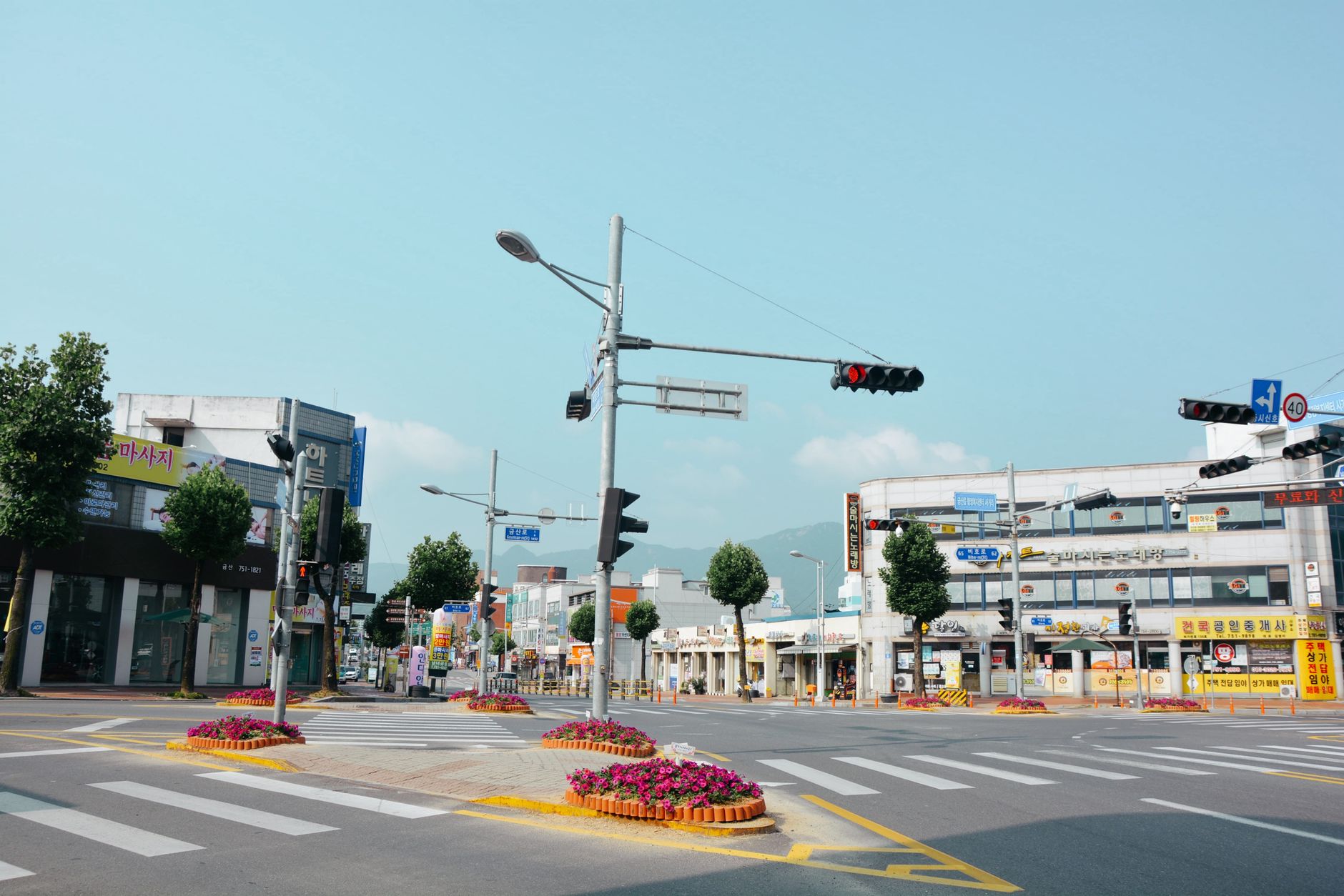 A serene city street intersection in South Korea showcasing urban architecture and street design.