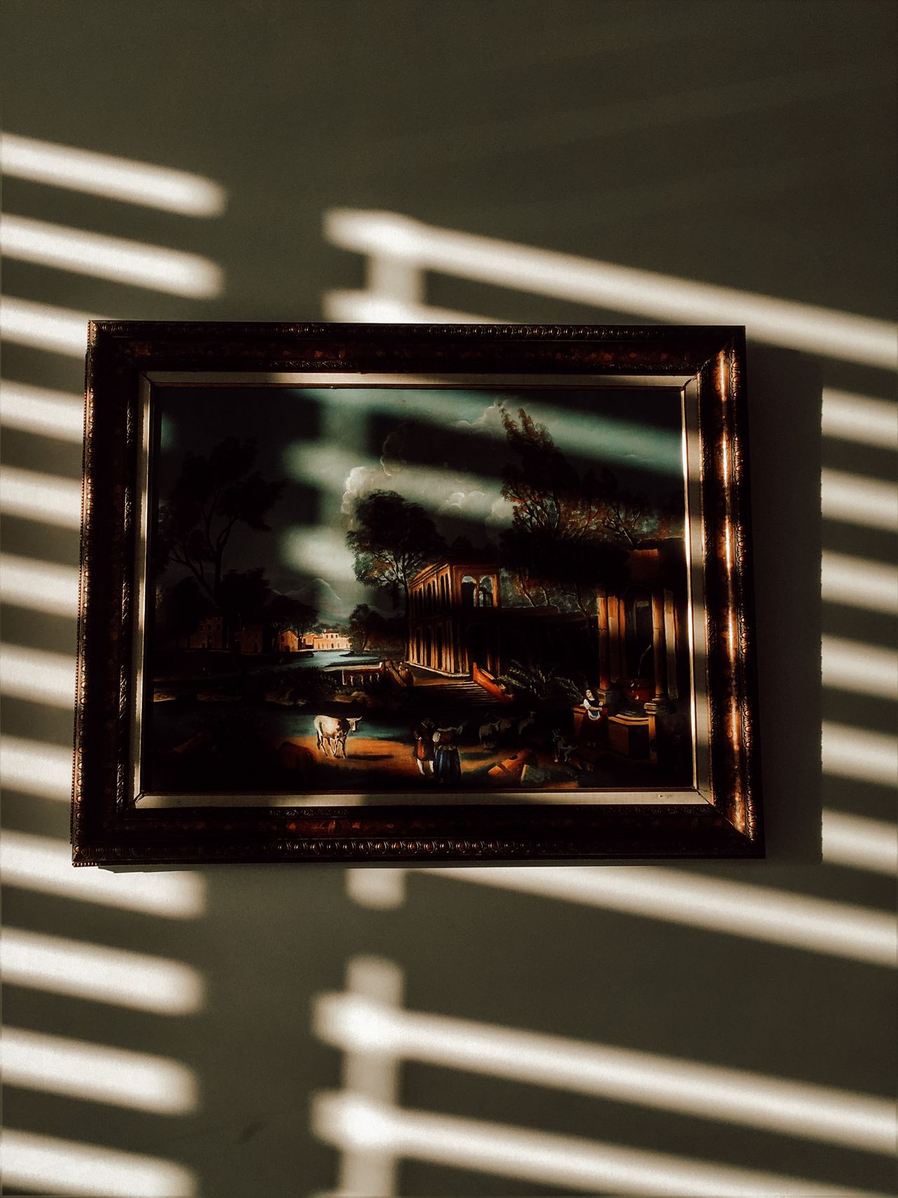 simple-kitchen-wall-art Framed artwork on a wall lit by warm sunlight