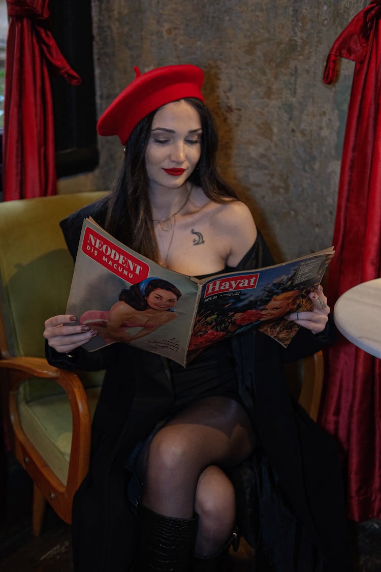 Beautiful Woman Reading A Magazine 