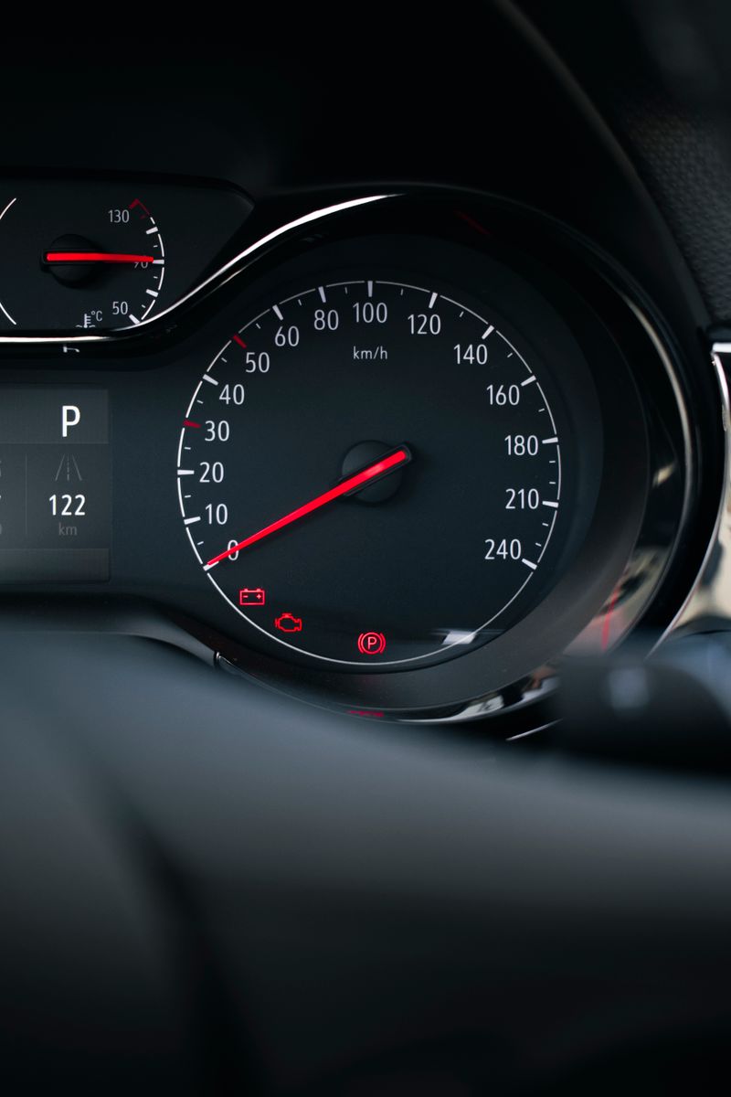 A close up of a dashboard with a speedometer · Free Stock Photo