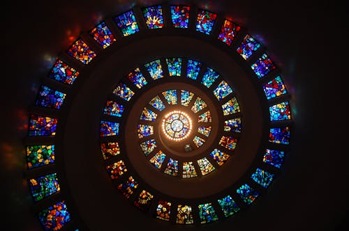 Worms Eye View of Spiral Stained Glass Decors Through the Roof