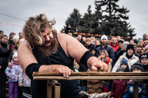 Man Ripping Wood with His Bare Hands