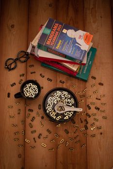 Artistic arrangement of books, numbers, and a bowl creating a thought-provoking scene. - Fotografer Sidoarjo