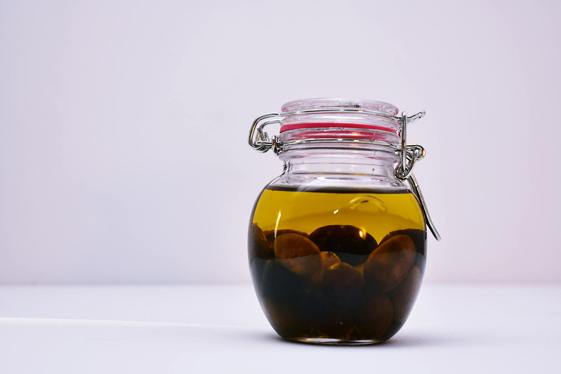 Clear Airtight Canister With Brown Liquid