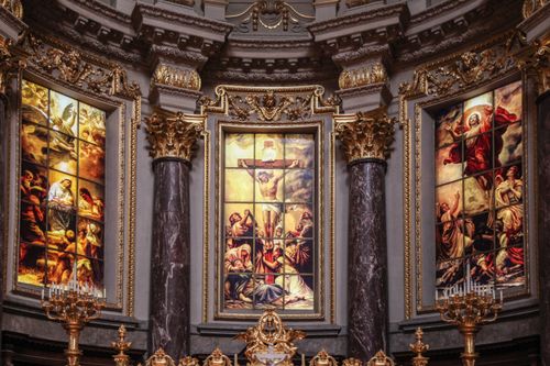 Free Intricate interior of a church with stunning stained glass artworks and rich architectural detail. Stock Photo