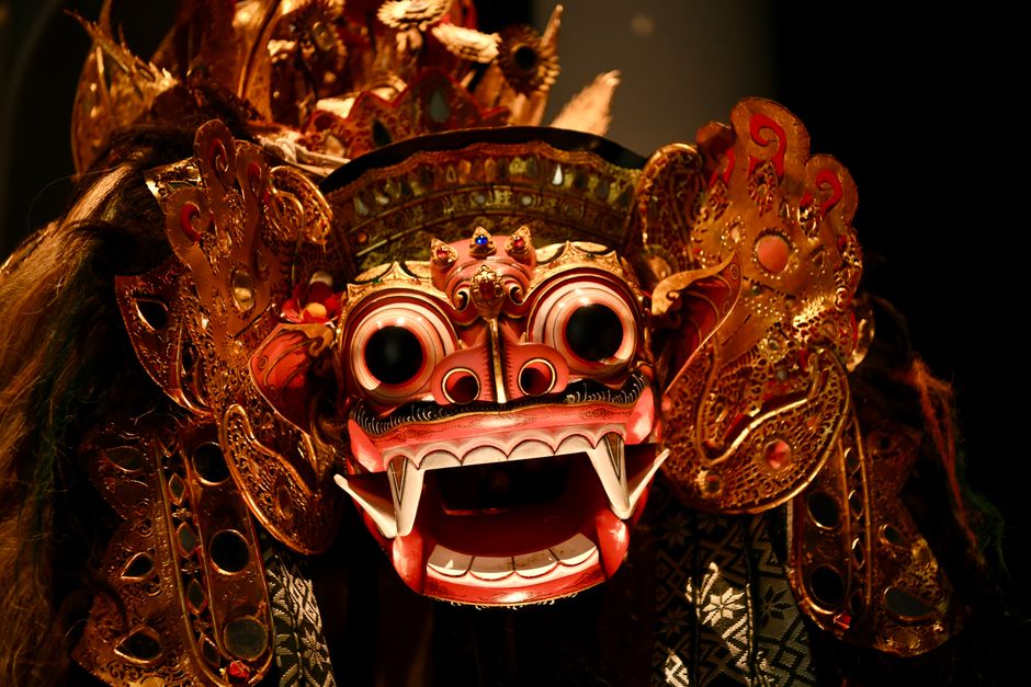 Close-up of a detailed Balinese Barong mask showcasing traditional craftsmanship and vibrant colors.