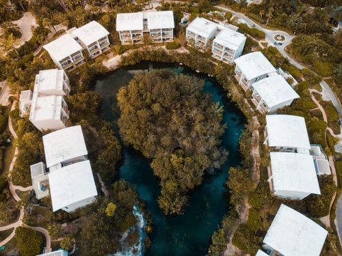Free Stunning aerial view of a resort surrounding a lush lagoon in Playa del Carmen, Mexico. Stock Photo