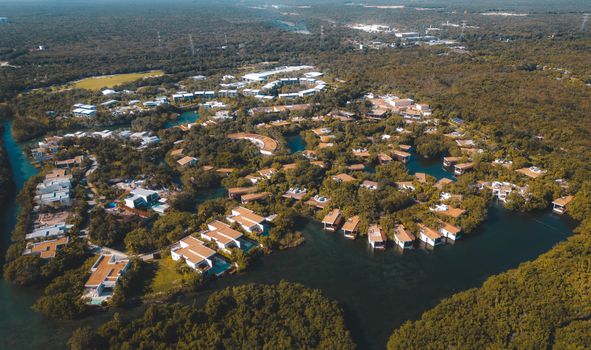 Stunning aerial view of a resort and forest in Playa del Carmen, Mexico.