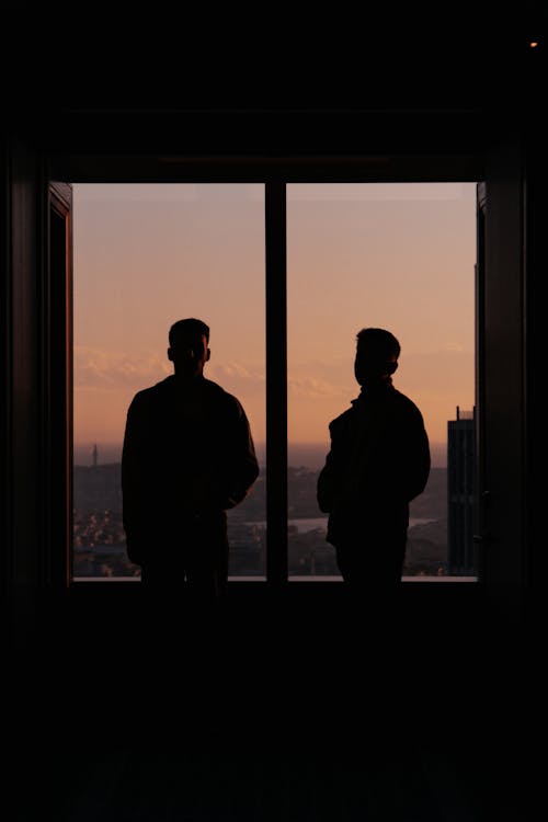 Silhouettes of Men by Window