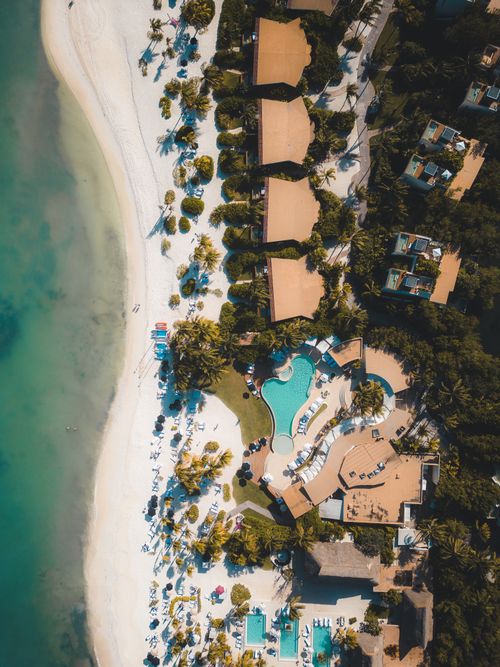 Free Stunning aerial view of a beach resort in Playa del Carmen, offering a glimpse of luxury and relaxation. Stock Photo