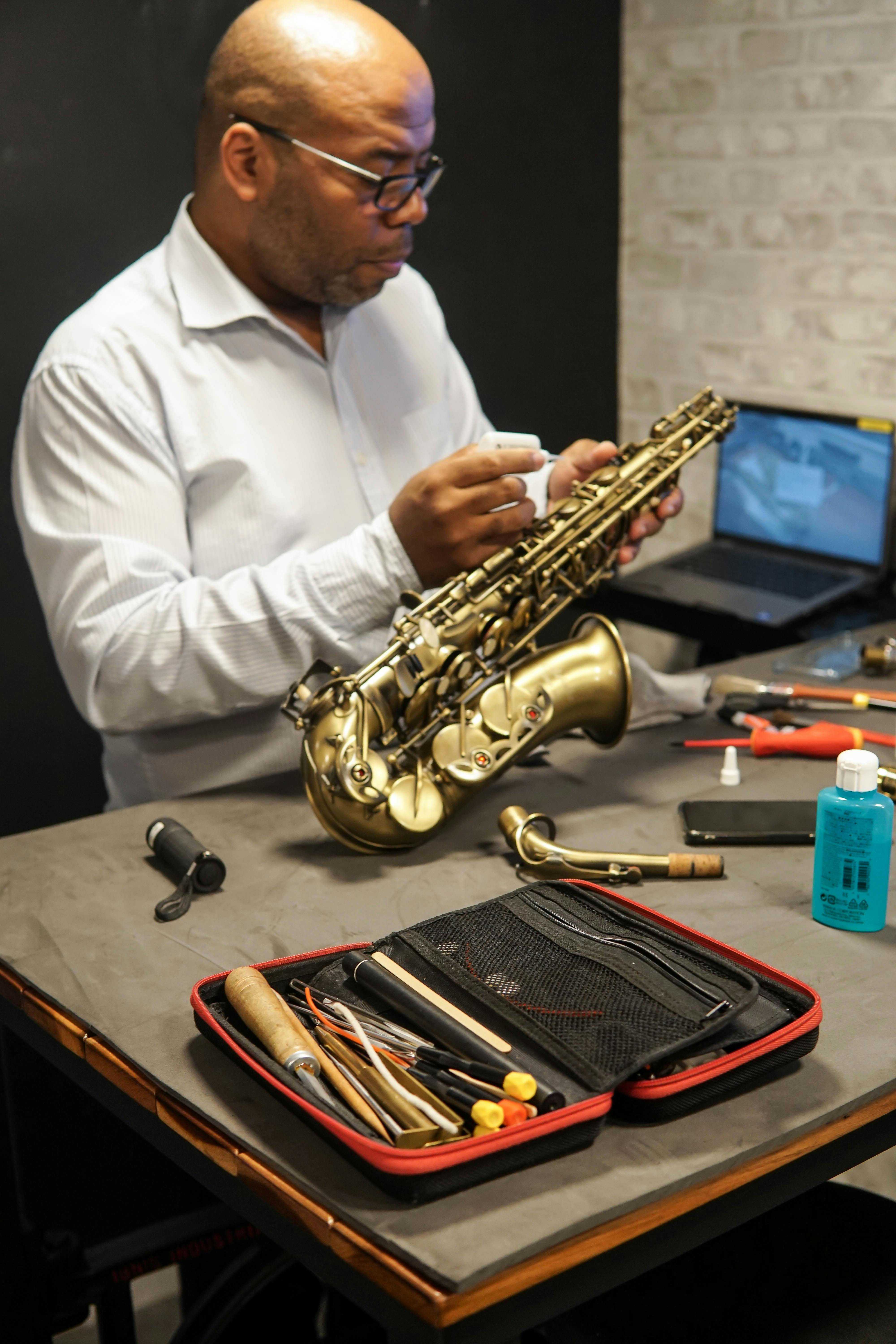 Man Repairing a Saxophone · Free Stock Photo